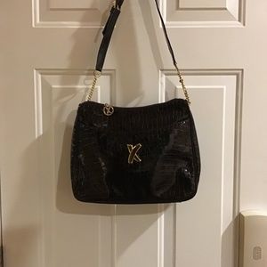 Elegant deep chocolate brown patent Paloma Picasso bag